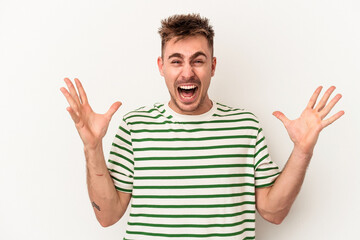 Fototapeta premium Young caucasian man isolated on white background screaming to the sky, looking up, frustrated.