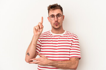 Young caucasian man isolated on white background having some great idea, concept of creativity.