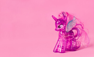 Lviv Ukraine -  11 11 2021: Children's toy my little pony purple twilight sparkle plastic on a pink...