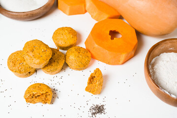 pumpkin cupcakes in a baking dish with chia seeds, autumn orange pie with orange.