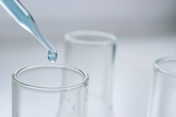 Science laboratory test tubes and pipette