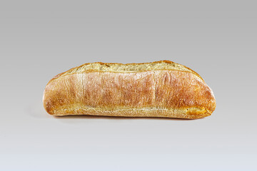 Italian ciabatta with a crisp golden crust on a light background