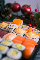 Sushi nigiri and maki set  with Christmas or New Year concept background. Traditional japanese food.