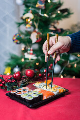Sushi nigiri and maki set  with Christmas or New Year concept background. Traditional japanese food.