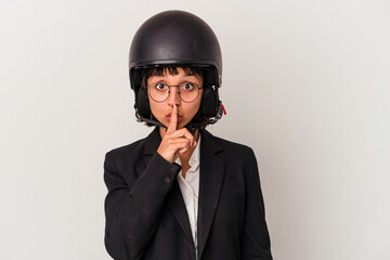 Young mixed race business woman wearing a motorbike helmet isolated keeping a secret or asking for...