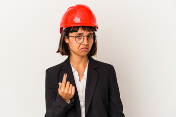 Young architect woman with red helmet isolated on white background pointing with finger at you as if inviting come closer.