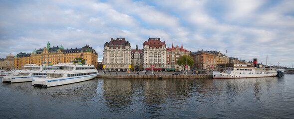 The pier Strandvägen at the bay Ladugårdsviken with commuting boats, hotels, offices and...