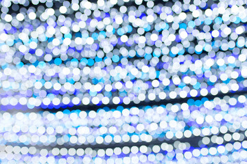 Blurred bokeh of Christmas light background.