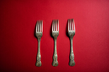 fork and knife on red background
