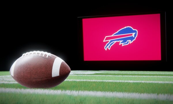 American football in foreground with logo of NFL team Buffalo Bills projected on screen in background. Editorial 3D illustration