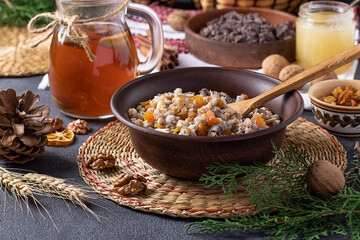 Kutya is a ceremonial grain dish with poppy seeds, dried fruits and sweet gravy, traditionally served by Orthodox Christians in Ukraine, Belarus and Russia during Christmas. Closeup