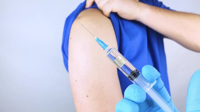 Concept. Chipping through vaccinations. Government conspiracy. Vaccination and implantation of a tracking microchip into the human body. Implantation of electronic technologies into the human body
