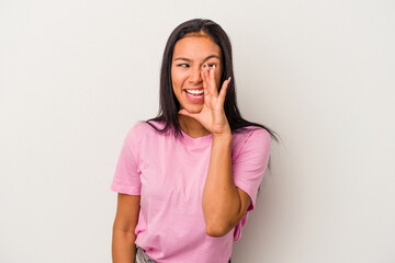 Young latin woman isolated on white background  shouting excited to front.