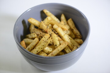 French fries in a gray plate on a white background
