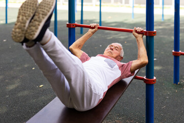 Elderly man exercising fitness outdoors