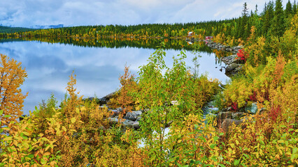 Fototapeta na wymiar view on lake in nordic autumnally colored landscape