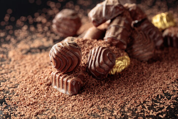 Chocolate candies sprinkled with chocolate chips.