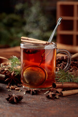 Herbal tea with cinnamon, anise, and dried herbs.