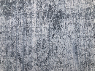 Painted gray wall with white brush strokes