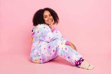 Full body profile side photo of young african girl wear warm overall bedtime isolated over pink...
