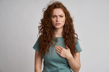 Young woman with pain of chest - obrazy, fototapety, plakaty
