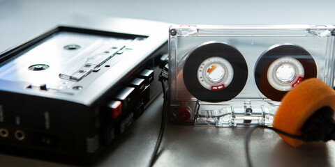 Music listening concept. Vintage cassette tape, audio player and headphones.