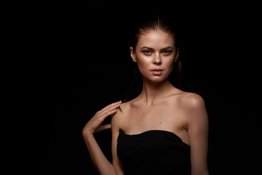 woman model bare shoulders clean skin wet hair dark background