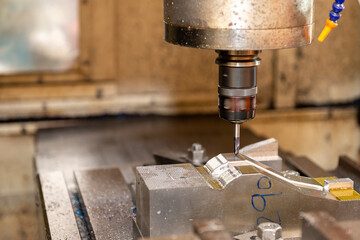 The mold and die manufacturing process by CNC milling machine.