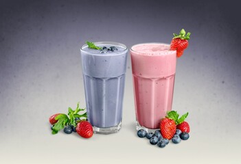 Tasty milkshake with blueberries in a glass on  background. Healthy dessert