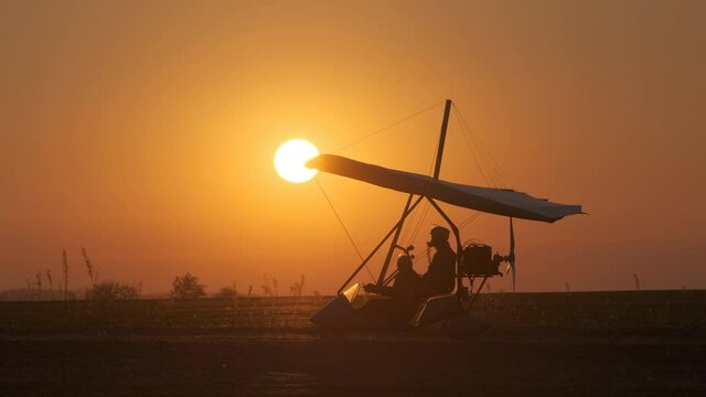 The testing flight by hang glider on the beautiful sky background. slow motion
