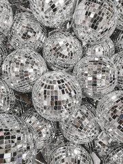 Sale of little disco balls for Christmas tree. Decorative mirror balls for New Year celebration. - obrazy, fototapety, plakaty