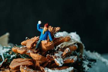 miniature kid about to throw a snowball