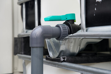 Close up of the colored water tap of an ibc container
