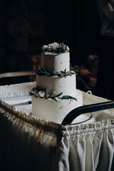 large white wedding cake on a stand
