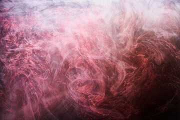 Pink smoke on black ink background, colorful fog, abstract swirling touch ocean sea, acrylic paint pigment underwater