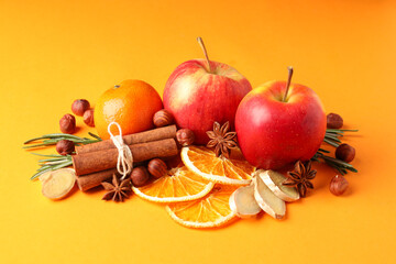 Ingredients for cooking mulled wine on orange background