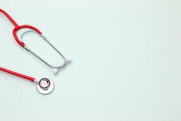 Close up of the medical object. stethoscope on green background. selective focus