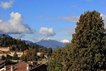 Fototapeta na wymiar Italy: Glimpse of the Alps seen from Bergamo Alta.