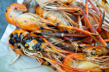 Many large grilled shrimps well cooking as seafood for a delicious and tasty meal and healthy