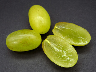 Large green seedless grapes cut in half