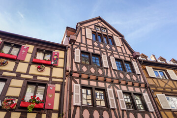 Fototapeta na wymiar Traditional half timbered facade and colorful beautiful architecture in Colmar old town, Alsace region, France