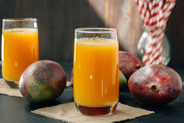 Mango juice in a glass, fresh fruit drink