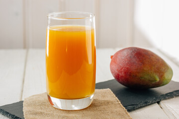 Mango juice in a glass, fresh fruit drink - 469328648