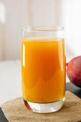Mango juice in a glass, fresh fruit drink