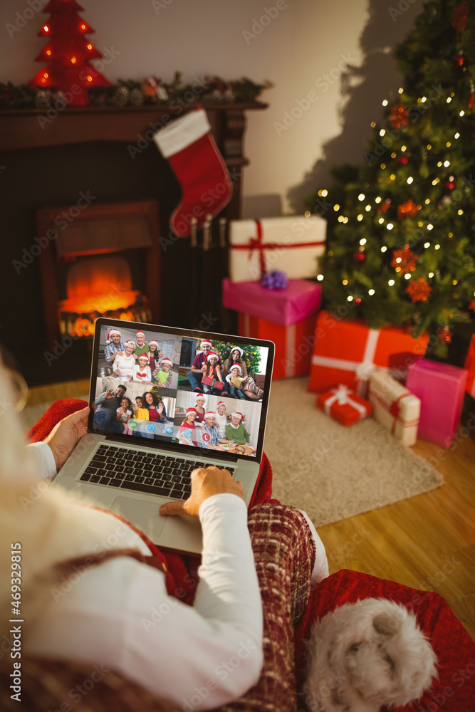 Poster Santa claus making laptop christmas group video call with four diverse families