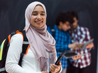 Modern arab teens use smartphone, tablet and latpop to study during online classes due to corona...