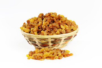Raisins in a wicker bowl isolated on white