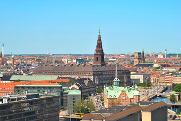 Fototapeta na wymiar Aerial View of Christiansborg Palace, Church of Holmen, Old Stock Exchange (Boersen) and Ministry of Foreign Affairs of Denmark. Old Architecture Against Cloudless Sky in Copenhagen, Spring 2012.