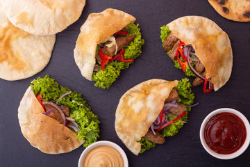 Pita with salad , paprika and beef meat