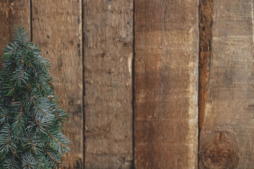 Stylish christmas tree on rustic  background. Space for text. Season's greeting. Handmade fir tree